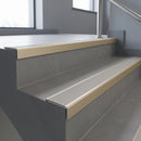 Light Bronze square edge aluminium stair nosing with Light Grey Castellated infill, fitted to a concrete step