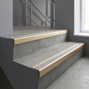 Light Bronze square edge aluminium stair nosing with Mill Aluminium infill, fitted to a concrete step