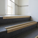 Light Bronze square edge aluminium stair nosing with Olive Castellated infill, fitted to a concrete step