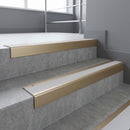 Light Bronze square edge aluminium stair nosing with Polar Grey Castellated infill, fitted to a concrete step