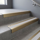 Light Bronze square edge aluminium stair nosing with Polar Grey Smooth Textured infill, fitted to a concrete step