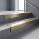 Light Bronze square edge aluminium stair nosing with Polished Aluminium infill, fitted to a concrete step
