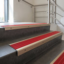 Light Bronze square edge aluminium stair nosing with Poppy Castellated infill, fitted to a concrete step