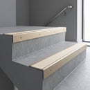 Light Bronze square edge aluminium stair nosing with Porth Stone Castellated infill, fitted to a concrete step