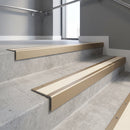 Light Bronze square edge aluminium stair nosing with Porth Stone Smooth Textured infill, fitted to a concrete step