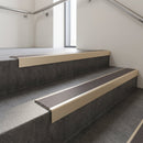 Light Bronze finish with Regency Castellated insert - Aluminium Stair Nosing 63.3x30mm Square Front fitted to a step edge