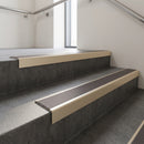 Light Bronze square edge aluminium stair nosing with Regency Castellated infill, fitted to a concrete step