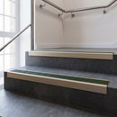 Light Bronze square edge aluminium stair nosing with Spruce Castellated infill, fitted to a concrete step