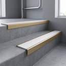 Light Bronze square edge aluminium stair nosing with White Castellated infill, fitted to a concrete step