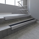 Mill Aluminium square edge aluminium stair nosing with Black Anodised Aluminium infill, fitted to a concrete step
