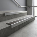 Mill Aluminium square edge aluminium stair nosing with Granite Castellated infill, fitted to a concrete step