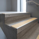 Mill Aluminium square edge aluminium stair nosing with Ivory Castellated infill, fitted to a concrete step
