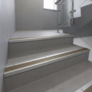 Mill Aluminium square edge aluminium stair nosing with Light Bronze Aluminium infill, fitted to a concrete step