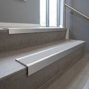 Mill Aluminium square edge aluminium stair nosing with Light Grey Smooth Textured infill, fitted to a concrete step