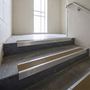 Mill Aluminium square edge aluminium stair nosing with Olive Castellated infill, fitted to a concrete step