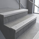 Mill Aluminium square edge aluminium stair nosing with Polar Grey Castellated infill, fitted to a concrete step