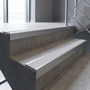 Mill Aluminium square edge aluminium stair nosing with Polar Grey Smooth Textured infill, fitted to a concrete step