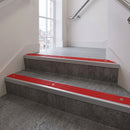 Mill Aluminium square edge aluminium stair nosing with Poppy Castellated infill, fitted to a concrete step