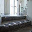 Mill Aluminium square edge aluminium stair nosing with Regency Castellated infill, fitted to a concrete step