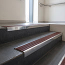 Polished Aluminium finish with Claret Castellated insert - Aluminium Stair Nosing 59x30mm Slimline Square Back fitted to a step edge