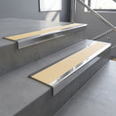 Polished Aluminium square edge aluminium stair nosing with Ivory Castellated infill, fitted to a concrete step
