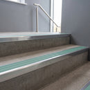 Polished Aluminium square edge aluminium stair nosing with Jade Castellated infill, fitted to a concrete step