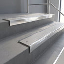 Polished Aluminium square edge aluminium stair nosing with Light Grey Castellated infill, fitted to a concrete step