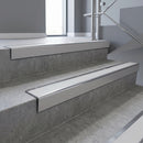 Polished Aluminium square edge aluminium stair nosing with Polar Grey Smooth Textured infill, fitted to a concrete step