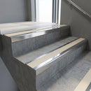 Polished Aluminium square edge aluminium stair nosing with Porth Stone Castellated infill, fitted to a concrete step