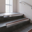 Polished Aluminium square edge aluminium stair nosing with Rustic Castellated infill, fitted to a concrete step