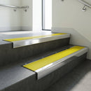 Polished Aluminium finish with Yellow Castellated insert - Aluminium Stair Nosing 59x30mm Slimline Square Back fitted to a step edge