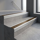 Satin Aluminium square edge aluminium stair nosing with Bronze Aluminium infill, fitted to a concrete step