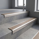 Satin Aluminium square edge aluminium stair nosing with Fawn Castellated infill, fitted to a concrete step