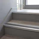 Satin Aluminium square edge aluminium stair nosing with Flint Castellated infill, fitted to a concrete step
