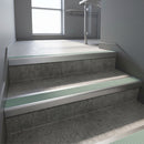 Satin Aluminium square edge aluminium stair nosing with Jade Castellated infill, fitted to a concrete step