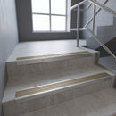 Satin Aluminium square edge aluminium stair nosing with Light Bronze Aluminium infill, fitted to a concrete step