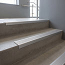 Satin Aluminium square edge aluminium stair nosing with Mill Aluminium infill, fitted to a concrete step