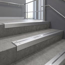 Satin Aluminium square edge aluminium stair nosing with Polished Aluminium infill, fitted to a concrete step