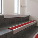 Satin Aluminium square edge aluminium stair nosing with Poppy Castellated infill, fitted to a concrete step