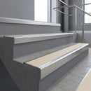 Satin Aluminium square edge aluminium stair nosing with Porth Stone Castellated infill, fitted to a concrete step