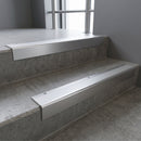 Satin Aluminium square edge aluminium stair nosing with Satin Aluminium infill, fitted to a concrete step