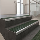 Satin Aluminium square edge aluminium stair nosing with Spruce Castellated infill, fitted to a concrete step
