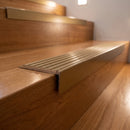 Aluminium Stair Nosing 63.5mm Tread Raked Back Single Channel in bronze finish fitted on a step edge