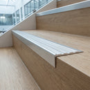 Aluminium Stair Nosing 63.5mm Tread Raked Back Single Channel in satin aluminium finish fitted on a step edge