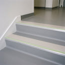 Canvas insert 63mm x 32mm aluminium stair nosing with photoluminescent front strip fitted to grey vinyl steps