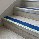Cobalt Blue insert 63mm x 32mm aluminium stair nosing with photoluminescent front strip fitted to terrazzo steps