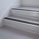 Black Anodised Aluminium insert in a 66x55mm square front aluminium stair nosing with 13mm Polar Grey riser highlight, fitted to interior steps