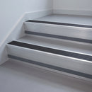 Black Anodised Aluminium insert in a 66x55mm square front aluminium stair nosing with 13mm Light Grey riser highlight, fitted to interior steps