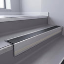 Black Smooth Textured insert in a 66x55mm square front aluminium stair nosing with 13mm Polar Grey riser highlight, fitted to interior steps
