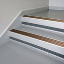 Bronze Aluminium insert in a 66x55mm square front aluminium stair nosing with 13mm Light Grey riser highlight, fitted to interior steps
